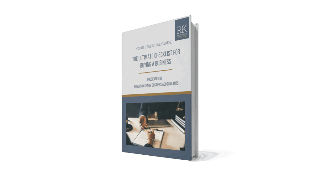 A 3D-rendered book titled "The Ultimate Checklist for Buying a Business" by Reid & Knotz Business Accountants, featuring a cover photo of hands writing on paperwork beside a laptop and coffee cup.