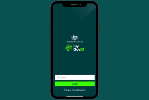 A smartphone screen displays the myGovID app login page by the Australian Government. The screen has fields for entering a password and buttons labeled "Login" and "I forgot my password." Ideal for a Tax Accountant or anyone seeking tax advice, the background is dark green.